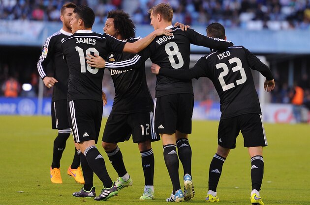 VIGO, SPAIN - APRIL 26:  Toni Kroos of Real Madrid celebrates with James Rodriguez and Isco after scoring Real's opening goal during the La Liga match between Celta Vigo and Real Madrid CF at Estadio Balaidos on April 26, 2015 in Vigo, Spain.  (Photo by Denis Doyle/Getty Images)