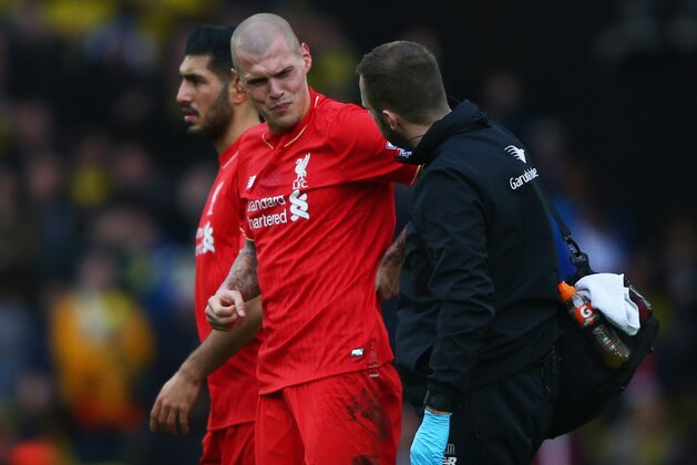 WATFORD, ENGLAND - DECEMBER 20:  Martin Skrtel of Liverpool (37) is given assitance during the Barclays Premier League match between Watford and Liverpool at Vicarage Road on December 20, 2015 in Watford, England.  (Photo by Ian Walton/Getty Images)