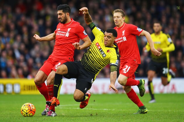 WATFORD, ENGLAND - DECEMBER 20:  Troy Deeney of Watford battles with Emre Can and Lucas Leiva of Liverpool during the Barclays Premier League match between Watford and Liverpool at Vicarage Road on December 20, 2015 in Watford, England.  (Photo by Richard Heathcote/Getty Images)