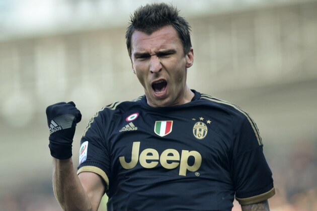 Juventus' Mario Mandzukic celebrates after scoring during a Serie A soccer match against Carpi, at Modena's Braglia stadium, Italy, Sunday, Dec. 20, 2015. (AP Photo/Marco Vasini)