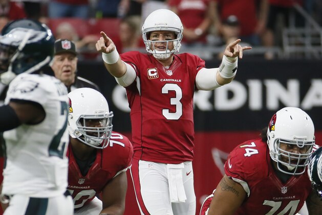 Arizona Cardinals quarterback Carson Palmer (3) calls a play against the Philadelphia Eagles during the first half of an NFL football game, Sunday, Oct. 26, 2014, in Glendale, Ariz. (AP Photo/Matt York)