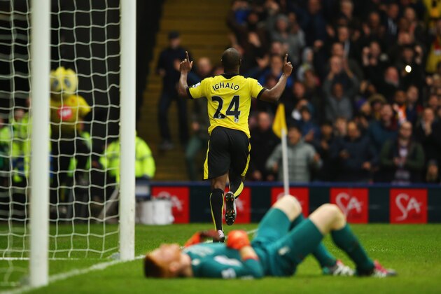 WATFORD, ENGLAND - DECEMBER 20:  Adam Bogdan of Liverpool (front) looks dejected as Odion Ighalo of Watford celebrates as he scores their third goal during the Barclays Premier League match between Watford and Liverpool at Vicarage Road on December 20, 2015 in Watford, England.  (Photo by Richard Heathcote/Getty Images)