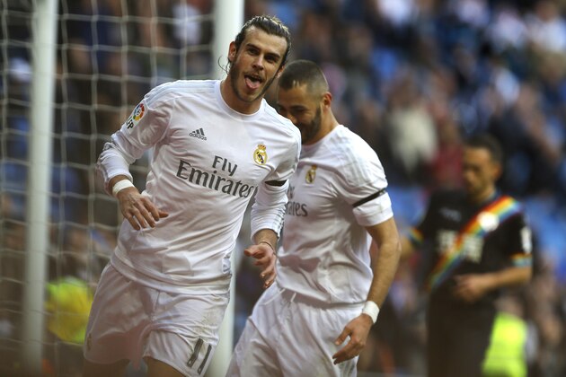 Real Madrid's Gareth Bale celebrates after scoring his side's fourth goal against Rayo Vallecano during the Spanish La Liga soccer match between Real Madrid and Rayo Vallecano at the Santiago Bernabeu stadium in Madrid, Sunday, Dec. 20, 2015. (AP Photo/Francisco Seco)