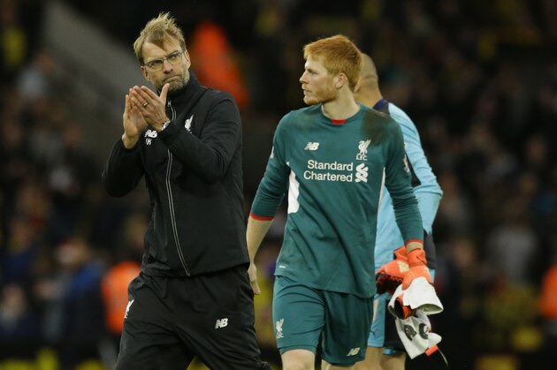 Liverpool's head coach Juergen Klopp, left, applauds his side next to goalkeeper Adam Bogdan after the English Premier League soccer match between Watford and Liverpool at Vicarage Road stadium in Watford, Sunday, Dec. 20, 2015. (AP Photo/Matt Dunham)