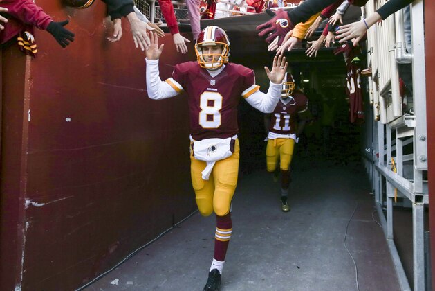 Washington Redskins quarterback Kirk Cousins (8) runs onto the field before an NFL football game against the Buffalo Bills in Landover, Md., Sunday, Dec. 20, 2015. (AP Photo/Andrew Harnik)