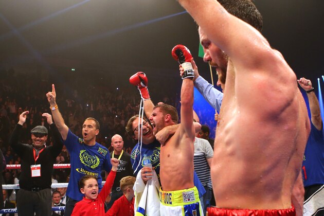 MANCHESTER, ENGLAND - DECEMBER 19: Billy Joe Saunders (C) celebrates beating Andy Lee during their WBO World Middleweight title fight at the Manchester Arena on December 19, 2015 in Manchester, England. (Photo by Dave Thompson/Getty Images)