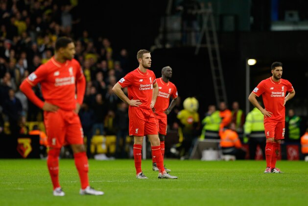 Liverpool's Jordan Henderson, second left, stands with his teammates as they wait while a Watford player receives injury treatment during the English Premier League soccer match between Watford and Liverpool at Vicarage Road stadium in Watford, Sunday, Dec. 20, 2015. (AP Photo/Matt Dunham)