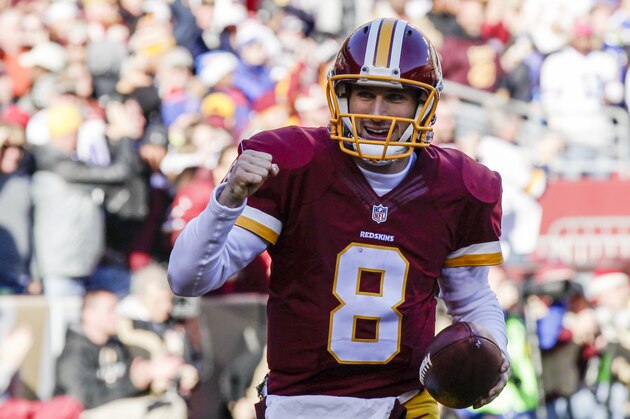 Washington Redskins quarterback Kirk Cousins (8) celebrates his touchdown during the first half of an NFL football game against the Buffalo Bills in Landover, Md., Sunday, Dec. 20, 2015. (AP Photo/Mark Tenally)