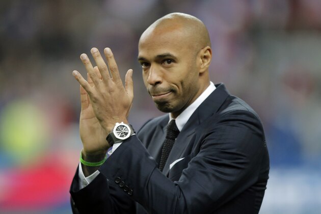 Former France's soccer player Thierry Henry acknowledges applause prior to the international friendly soccer match between France and Brazil at the Stade de France, north of Paris, France, Thursday, March 26, 2015. (AP Photo/Francois Mori)