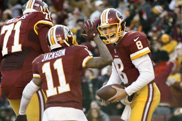 Washington Redskins quarterback Kirk Cousins (8) celebrates his touchdown with teammate DeSean Jackson during the first half of an NFL football game against the Buffalo Bills in Landover, Md., Sunday, Dec. 20, 2015. (AP Photo/Andrew Harnik)