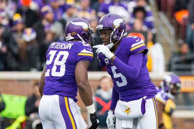 Dec 20, 2015; Minneapolis, MN, USA; Minnesota Vikings quarterback Teddy Bridgewater (5) talks to running back Adrian Peterson (28) in the first quarter against the XXXXChicago BearsXX at TCF Bank Stadium. Mandatory Credit: Brad Rempel-USA TODAY Sports