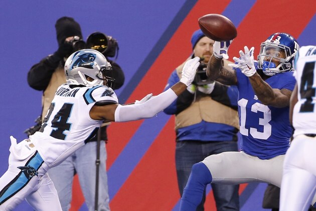 New York Giants' Odell Beckham (13) catches a pass for a touchdown in front of Carolina Panthers' Josh Norman (24) during the second half of an NFL football game Sunday, Dec. 20, 2015, in East Rutherford, N.J. (AP Photo/Kathy Willens)