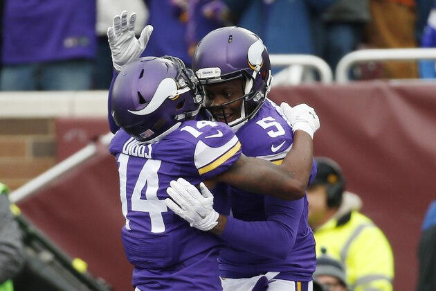 Minnesota Vikings quarterback Teddy Bridgewater (5) celebrates a touchdown by wide receiver Stefon Diggs (14) during the first half of an NFL football game against the Chicago Bears, Sunday, Dec. 20, 2015, in Minneapolis. (AP Photo/Alex Brandon)