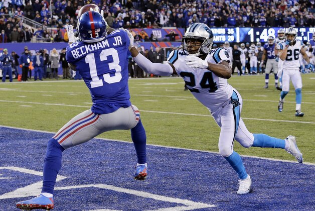 New York Giants wide receiver Odell Beckham (13) catches a pass for a touchdown in front of Carolina Panthers' Josh Norman (24) during the second half of an NFL football game Sunday, Dec. 20, 2015, in East Rutherford, N.J. (AP Photo/Julie Jacobson)