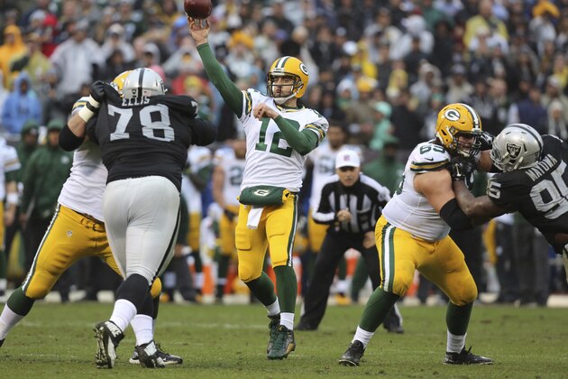 Green Bay Packers quarterback Aaron Rodgers in action against the Oakland Raiders during an NFL football game Sunday, Dec. 20, 2015, in Oakland, Calif. (AP Photo/Ryan Kang)