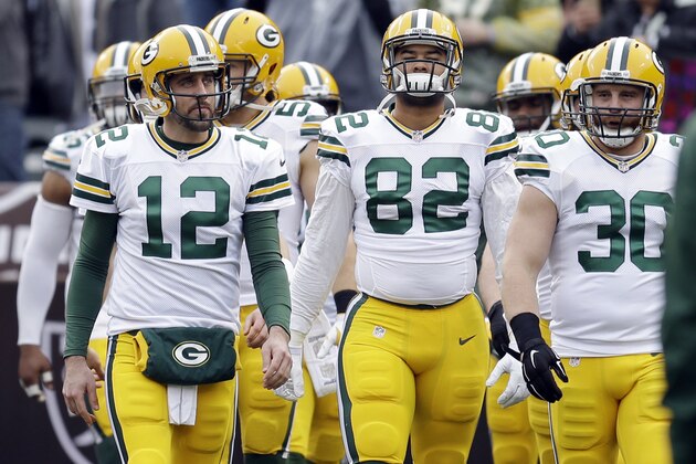 Green Bay Packers quarterback Aaron Rodgers (12) leads his team onto the field for  warms up before an NFL football game against the Oakland Raiders Sunday, Dec. 20, 2015, in Oakland, Calif. (AP Photo/Ben Margot)