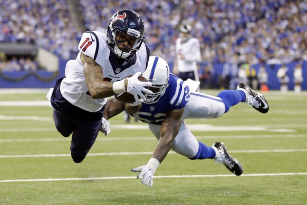 Houston Texans' Jaelen Strong (11) dives into the end zone for a 8-yard touchdown reception during the second half of an NFL football game against the Indianapolis Colts, Sunday, Dec. 20, 2015, in Indianapolis. Colts' D'Qwell Jackson (52) defends on the play. (AP Photo/Michael Conroy)