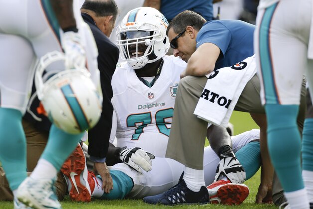 Miami Dolphins offensive tackle Branden Albert is treated on the field after getting hurt during the first half in an NFL football game against the San Diego Chargers Sunday, Dec. 20, 2015, in San Diego. (AP Photo/Gregory Bull) Miami Dolphins offensive tackle Branden Albert is treated on the field after getting hurt during the first half in an NFL football game against the San Diego Chargers Sunday, Dec. 20, 2015, in San Diego. (AP Photo/Gregory Bull)
