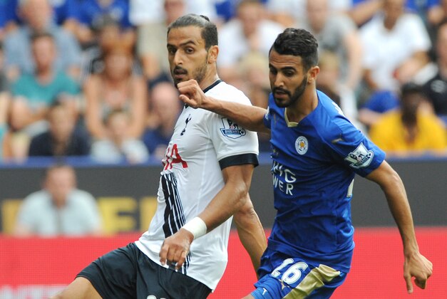 Tottenham’s Nacer Chadi, left, battles for the ball with Leicester’s Riyad Mahrez during the English Premier League soccer match between Leicester City and Tottenham Hotspur at the King Power Stadium, Leicester, England, Saturday, Aug. 22, 2015. (AP Photo/Rui Vieira)