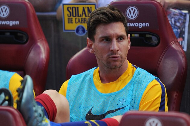 MADRID, SPAIN - SEPTEMBER 12:  Lionel Messi of FC Barcelona looks on from the substitutes bench during the La Liga match between Club Atletico de Madrid and FC Barcelona at Vicente Calderon Stadium on September 12, 2015 in Madrid, Spain.  (Photo by Denis Doyle/Getty Images)