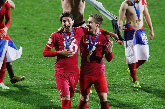 AUCKLAND, NEW ZEALAND - JUNE 20:  Marko Grujic of Serbia and Ivan Saponjic of Serbia celebrate after winning the FIFA U-20 World Cup Final match between Brazil and Serbia at North Harbour Stadium on June 20, 2015 in Auckland, New Zealand.  (Photo by Hannah Peters/Getty Images)