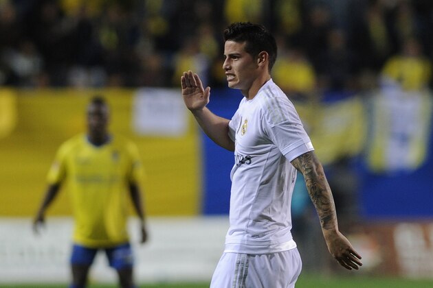 Real Madrid's Colombian midfielder James Rodriguez (R) gestures during the Spanish Copa del Rey (King's Cup) football match Cadiz CF vs Real Madrid at the Ramon de Carranza in Cadiz on December 2, 2015.  AFP PHOTO / CRISTINA QUICLER / AFP / CRISTINA QUICLER        (Photo credit should read CRISTINA QUICLER/AFP/Getty Images)