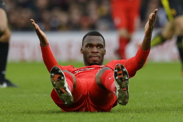 Liverpool's Christian Benteke reacts after a challenge during the English Premier League soccer match between Watford and Liverpool at Vicarage Road stadium in Watford, Sunday, Dec. 20, 2015. (AP Photo/Matt Dunham)