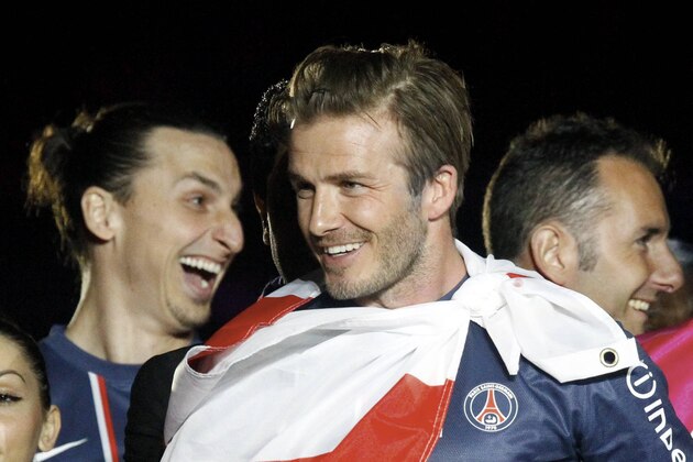 PARIS, FRANCE - MAY 18: David Beckham and Zlatan Ibrahimovic of Paris Saint-Germain celebrate after defeating Stade Brestois 29 at the French League 1 match at Parc des Princes on May 18, 2013 in Paris, France. (Photo by Xavier Laine/Getty Images)