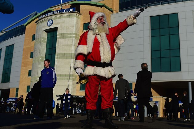 LONDON, ENGLAND - DECEMBER 13:  A fan takes a photograph of  'Father Christmas' prior to the Barclays Premier League match between Chelsea and Hull City at Stamford Bridge on December 13, 2014 in London, England.  (Photo by Jamie McDonald/Getty Images)