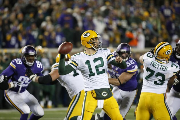 Green Bay Packers quarterback Aaron Rodgers (12) throws against the Minnesota Vikings during the second half of an NFL football game in Minneapolis, Sunday, Nov. 22, 2015. (AP Photo/Ann Heisenfelt)