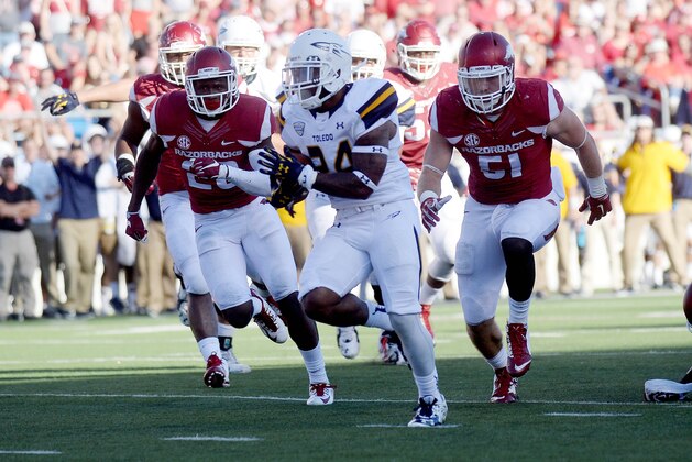 Sep 12, 2015; Little Rock, AR, USA; Toledo Rockets running back Damion Jones-Moore (24) runs the ball for a touchdown against the Arkansas Razorbacks during the second half at War Memorial Stadium. Mandatory Credit: Mark D. Smith-USA TODAY Sports
