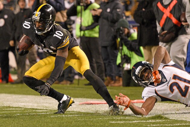 Pittsburgh Steelers wide receiver Martavis Bryant (10) slips the tackle by Denver Broncos cornerback Aqib Talib (21) after catching a pass from quarterback Ben Roethlisberger during the second half of an NFL football game in Pittsburgh, Sunday, Dec. 20, 2015. (AP Photo/Don Wright)