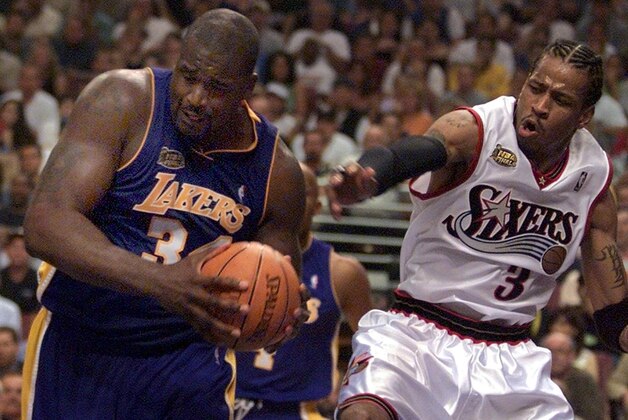 PHILADELPHIA, UNITED STATES:  Los Angeles Lakers center Shaquille O'Neal (L) pulls the ball away from Philadelphia 76ers guard Allen Iverson (R) during the second quarter of game four of the NBA Finals, 13 June, 2001 at the First Union Center in Philadelphia, PA. The Lakers lead the best-of-seven game series 2-1.   AFP PHOTO/Don EMMERT (Photo credit should read DON EMMERT/AFP/Getty Images)