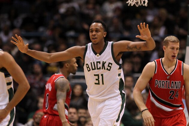 MILWAUKEE, WI - DECEMBER 07: John Henson #31 of the Milwaukee Bucks celebrates after making a plan dunk during the game against the Portland Trail Blazers at BMO Harris Bradley Center on December 7, 2015 in Milwaukee, Wisconsin. NOTE TO USER: User expressly acknowledges and agrees that, by downloading and or using this photograph, User is consenting to the terms and conditions of the Getty Images License Agreement. (Photo by Mike McGinnis/Getty Images)