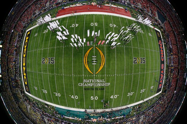 ARLINGTON, TX - JANUARY 12:  Flags are seen on the field before the College Football Playoff National Championship Game at AT&T Stadium on January 12, 2015 in Arlington, Texas.  (Photo by Tom Pennington/Getty Images)