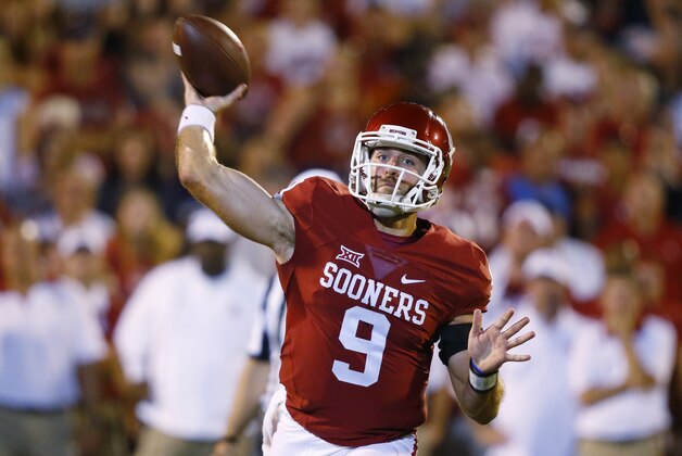 Oklahoma quarterback Trevor Knight (9) passes against Akron in the fourth quarter of an NCAA college football game in Norman, Okla., Saturday, Sept. 5, 2015. Oklahoma won 41-3. (AP Photo/Sue Ogrocki)