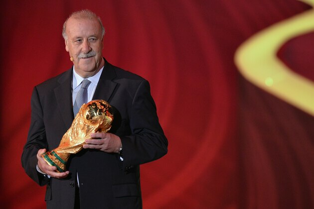 Spain's coach Vicente del Bosque holds the World Cup trophy won by Spain in the South Africa 2010 FIFA tournament during the final draw of the Brazil 2014 FIFA World Cup, in Costa do Sauipe, Bahia state, Brazil, on December 6, 2013. Thirty-two teams will learn their World Cup fate when the draw for Brazil's problem-plagued 2014 showpiece takes place today.     AFP PHOTO / NELSON ALMEIDA        (Photo credit should read NELSON ALMEIDA/AFP/Getty Images)