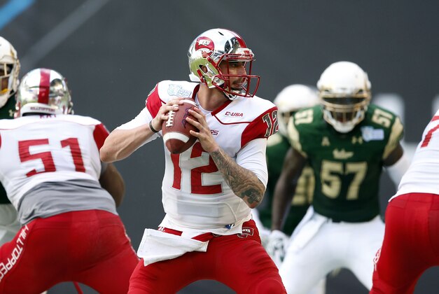 Dec 21, 2015; Miami, FL, USA;Western Kentucky Hilltoppers quarterback Brandon Doughty (12) throws a pass against South Florida Bulls during the first half in the 2015 Miami Beach Bowl at Marlins Park. Mandatory Credit: Steve Mitchell-USA TODAY Sports