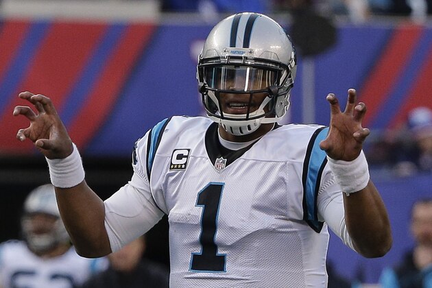 Carolina Panthers quarterback Cam Newton calls an audible at the line of scrimmage during the second half of an NFL football game against the New York Giants, Sunday, Dec. 20, 2015, in East Rutherford, N.J. (AP Photo/Julie Jacobson)