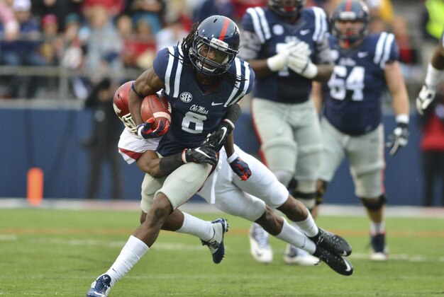 Nov 7, 2015; Oxford, MS, USA; Mississippi Rebels wide receiver Quincy Adeboyejo (8) is tackled by Arkansas Razorbacks defensive back Kevin Richardson (30) during the first quarter of the game at Vaught-Hemingway Stadium. Mandatory Credit: Matt Bush-USA TODAY Sports