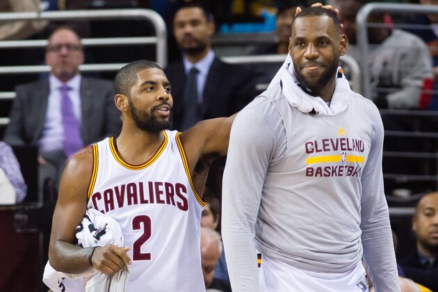 CLEVELAND, OH - DECEMBER 20: Kyrie Irving #2 and LeBron James #23 of the Cleveland Cavaliers celebrate on the sidelines during the second half against the Philadelphia 76ers at Quicken Loans Arena on December 20, 2015 in Cleveland, Ohio. The Cavaliers defeated the 76ers 108-86. NOTE TO USER: User expressly acknowledges and agrees that, by downloading and/or using this photograph, user is consenting to the terms and conditions of the Getty Images License Agreement. Mandatory copyright notice. (Photo by Jason Miller/Getty Images)