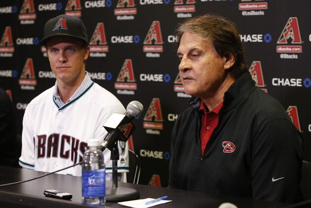 Arizona Diamondbacks Chief Baseball Officer Tony La Russa, right, talks to the media during a press conference introducing new pitcher Zack Greinke, Friday, Dec. 11, 2015, in Phoenix. (AP Photo/Rick Scuteri)