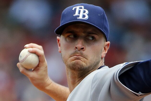 Tampa Bay Rays starting pitcher Jake Odorizzi delivers against the Boston Red Sox during the first inning of a baseball game at Fenway Park in Boston, Sunday, Aug. 2, 2015. (AP Photo/Winslow Townson)
