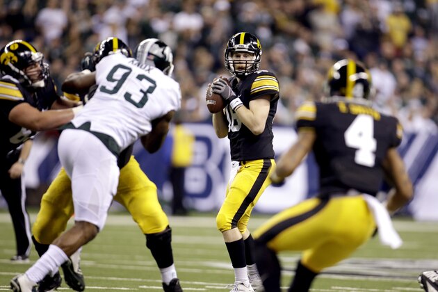 Iowa quarterback C.J. Beathard (16) looks to throw a pass against Michigan State during the first half of the Big Ten Conference championship NCAA college football game Saturday, Dec. 5, 2015, in Indianapolis. (AP Photo/AJ Mast)