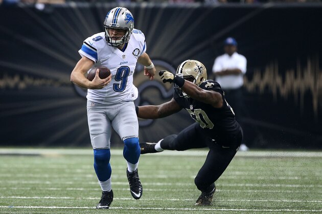 NEW ORLEANS, LA - DECEMBER 21:  Matthew Stafford #9 of the Detroit Lions avoids a tackle by Stephone Anthony #50 of the New Orleans Saints during the first quarter of a game at the Mercedes-Benz Superdome on December 21, 2015 in New Orleans, Louisiana.  (Photo by Chris Graythen/Getty Images)