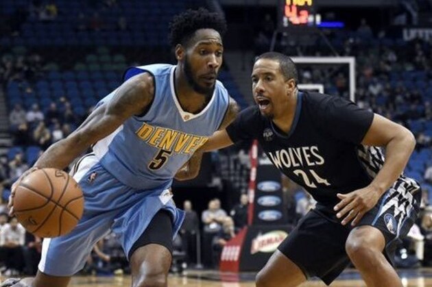 Denver Nuggets forward Will Barton (5) drives against Minnesota Timberwolves guard Andre Miller (24) during the fourth quarter of an NBA basketball game Tuesday, Dec. 15, 2015, in Minneapolis. The Nuggets won 112-100. (AP Photo/Hannah Foslien)