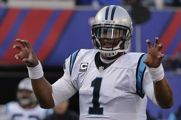 Carolina Panthers quarterback Cam Newton calls an audible at the line of scrimmage during the second half of an NFL football game against the New York Giants, Sunday, Dec. 20, 2015, in East Rutherford, N.J. (AP Photo/Julie Jacobson)