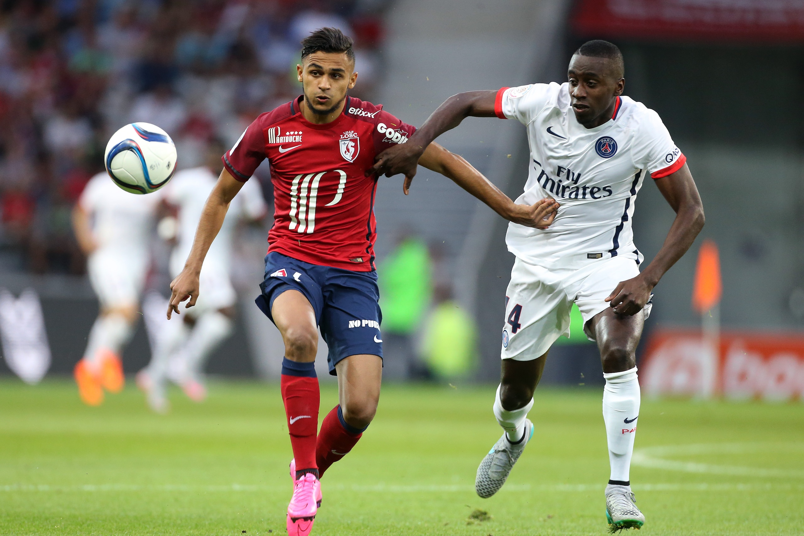 LILLE - AUGUST 7: Sofiane Boufal of Lille and Blaise Matuidi of PSG in action during the French Ligue 1 match between Lille OSC (LOSC) and Paris Saint-Germain (PSG) at Grand Stade Pierre Mauroy on August 7, 2015 in Lille, France. (Photo by Jean Catuffe/Getty Images)