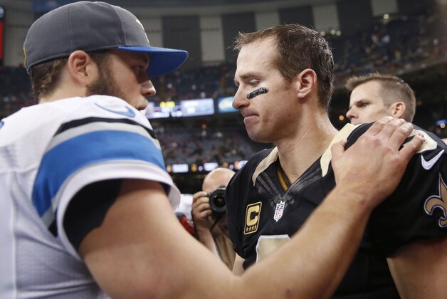 New Orleans Saints quarterback Drew Brees, right, greets Detroit Lions quarterback Matthew Stafford after an NFL football game in New Orleans, Monday, Dec. 21, 2015. The Lions won 35-27. (AP Photo/Brynn Anderson)