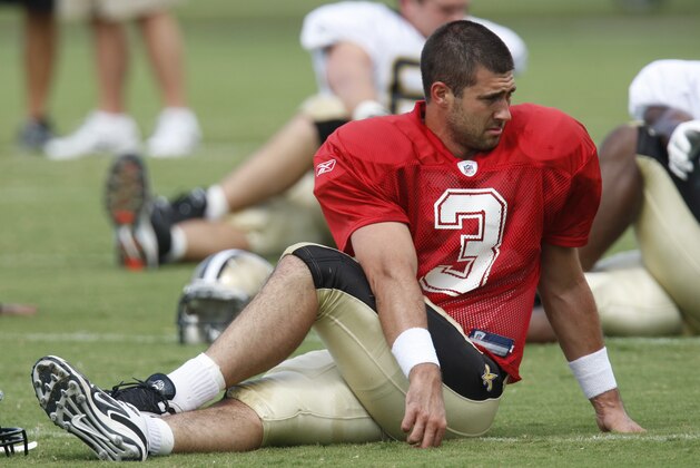 New Orleans Saints quarterback Joey Harrington (3) stretches at the club's football training camp in  Metairie, La., Tuesday, Aug. 4, 2009. (AP Photo/Bill Haber)